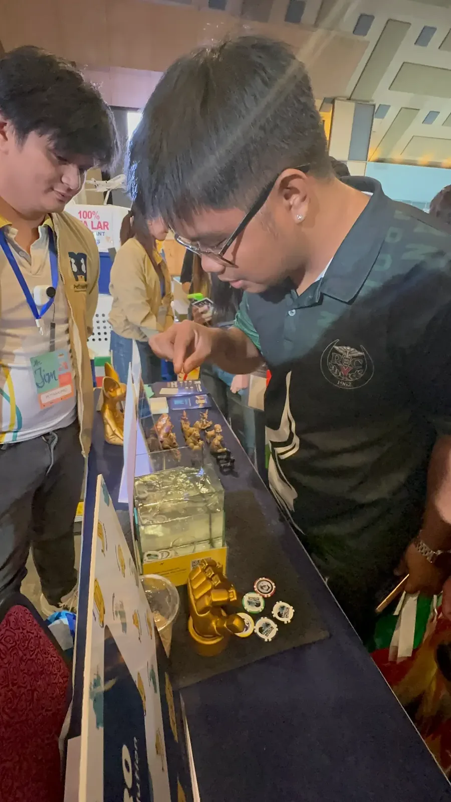 A visitor taking part in one of the two games we ran at the booth.
