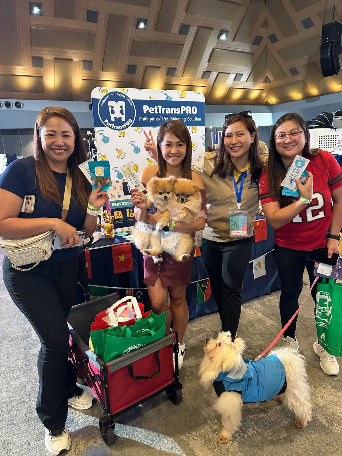 Pet parents with their Pomeranians and a Yorkie